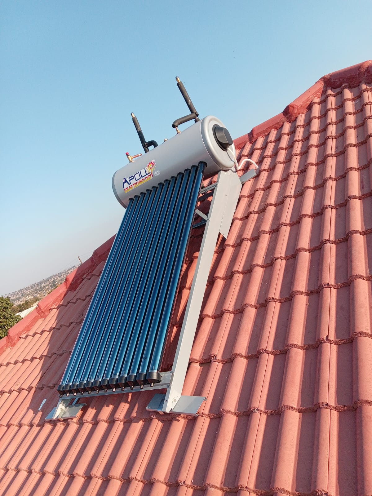 Apollo solar geyser with evacuated tube collector on tiled roof
