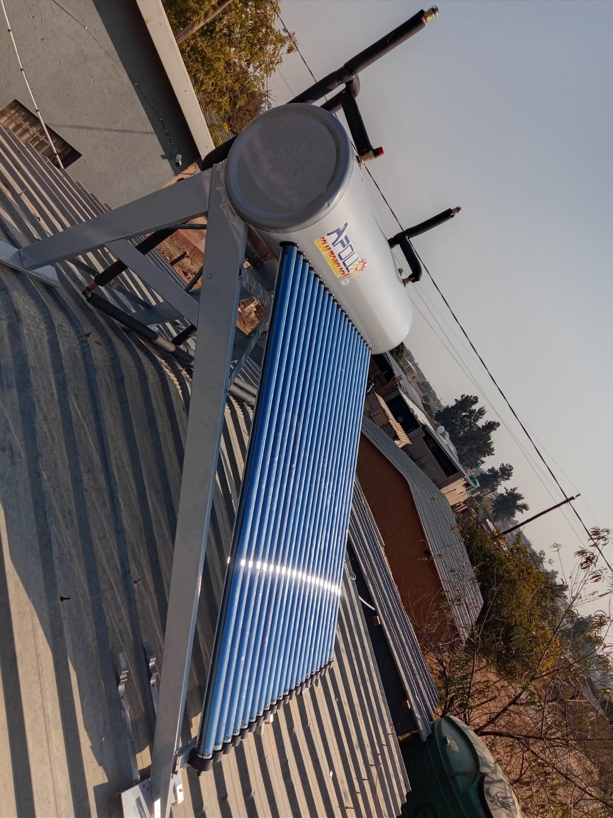 Apollo solar geyser with evacuated tubes on corrugated iron roof