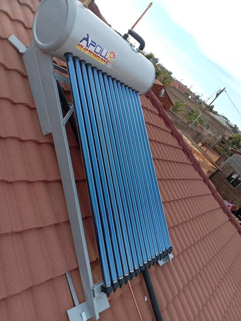 Apollo solar geyser with evacuated tubes installed on tiled roof close-up