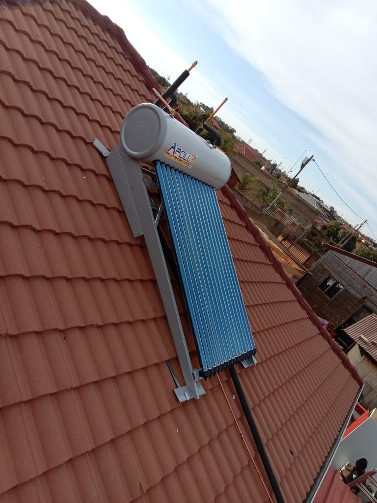 Apollo solar geyser with collector tubes on tiled roof wide view